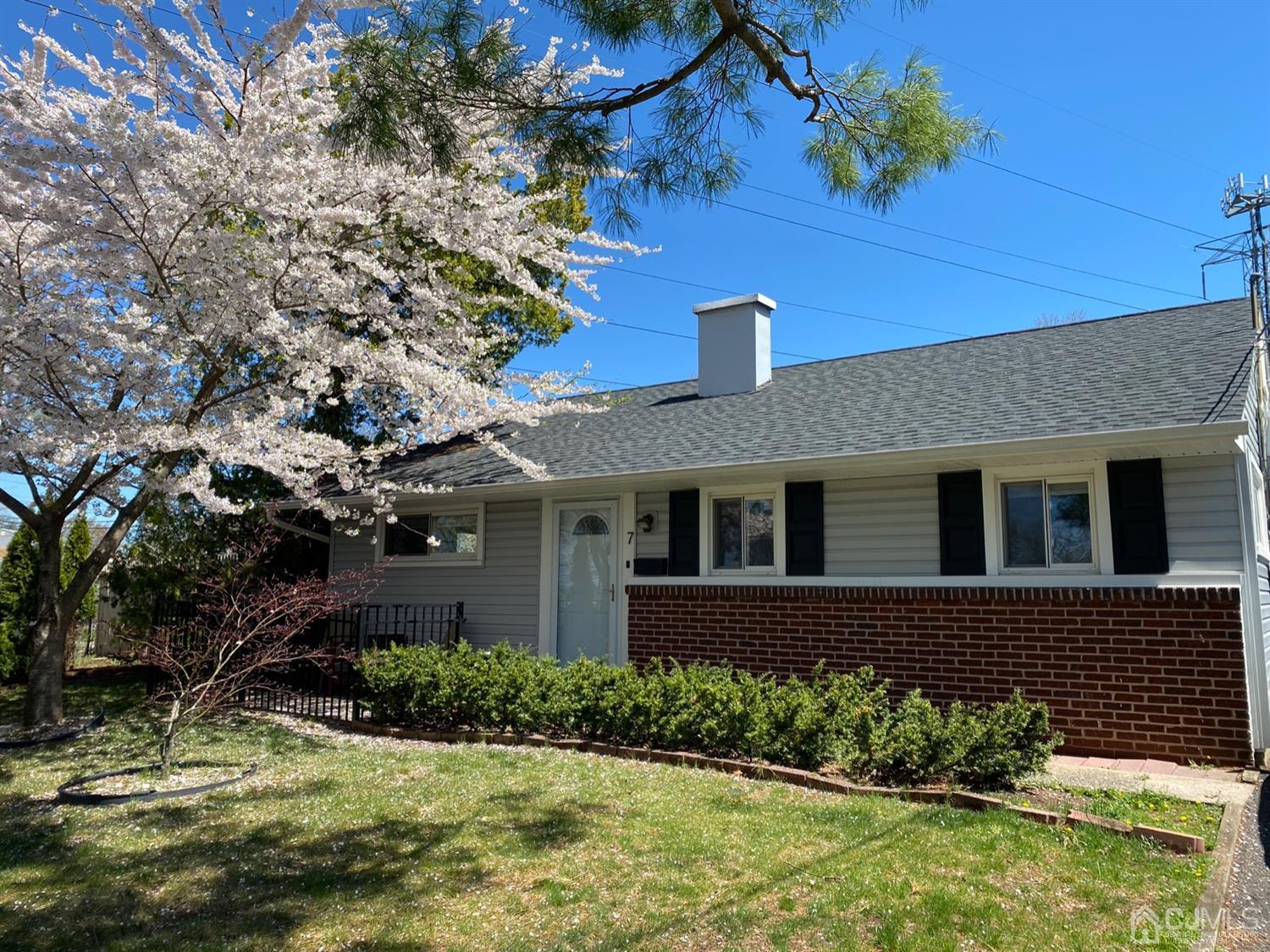 7 Colton Road Edison, NJ 08817 - Photo 2 of 9 a front view of a house with a yard