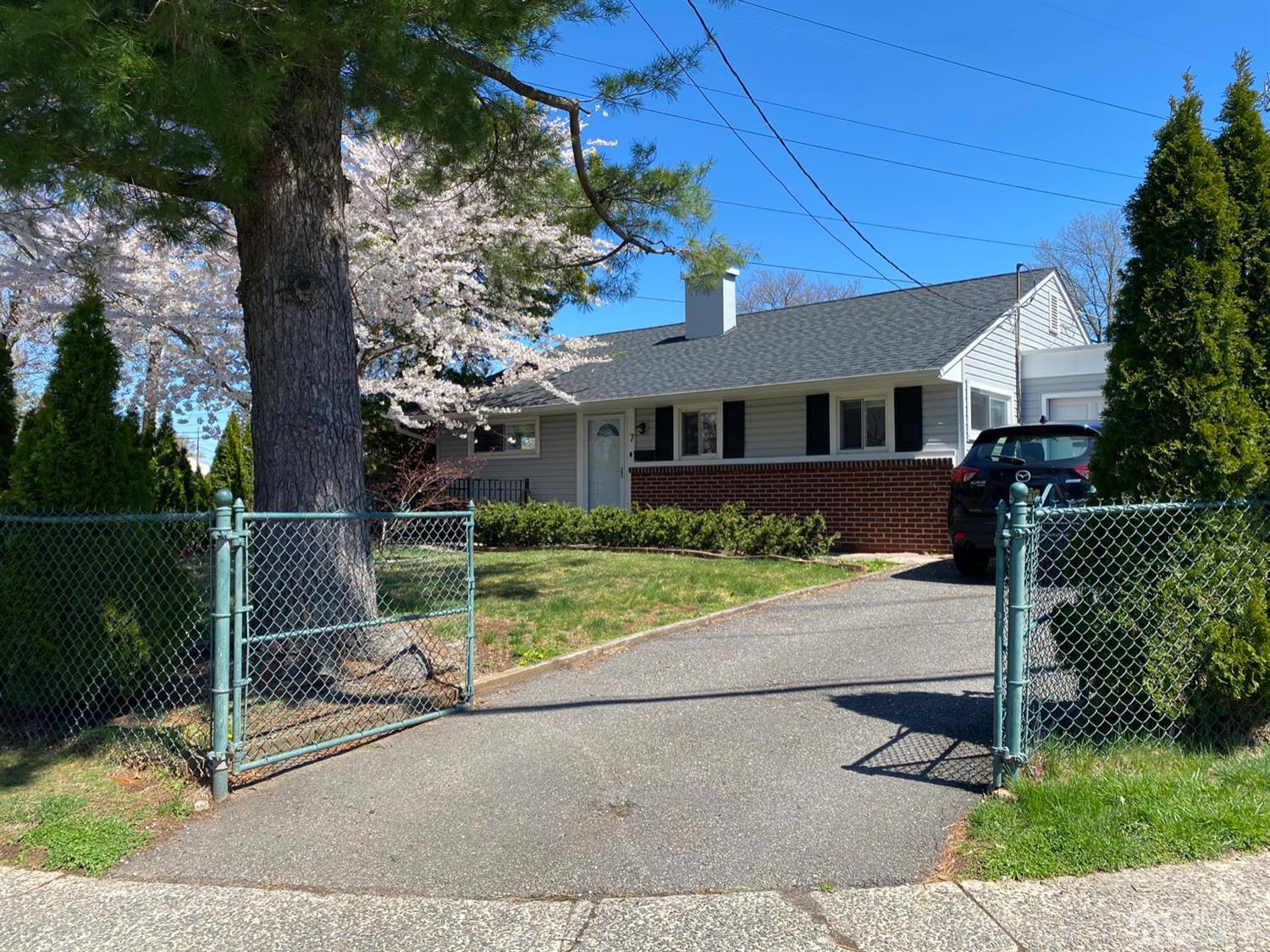 7 Colton Road Edison, NJ 08817 - Photo 4 of 9 a house view with a garden space