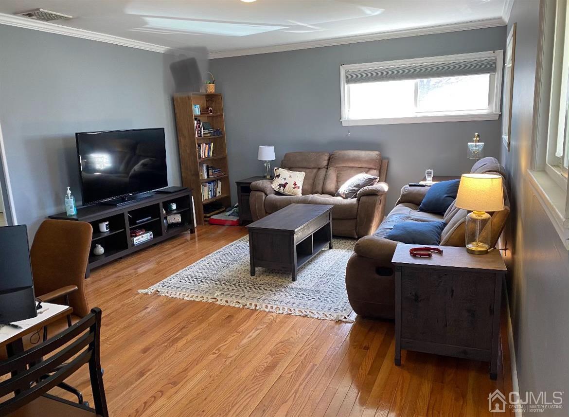 7 Colton Road Edison, NJ 08817 - Photo 5 of 9 a living room with furniture and a flat screen tv