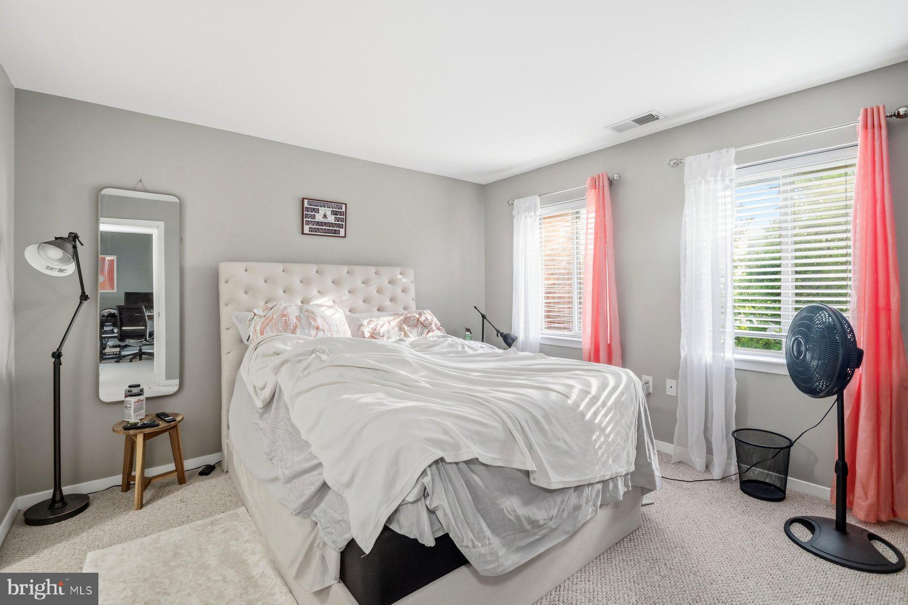 642 South Charles Street, Unit R 22 Baltimore, MD 21230 - Photo 19 of 26 a bedroom with a bed and a window