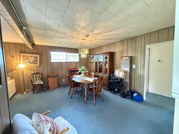 a bedroom with furniture and a window