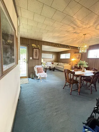 a bed room with furniture and a window