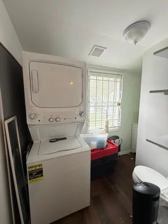 a view of a workspace with furniture and a kitchen