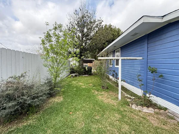 a view of a backyard with sitting area