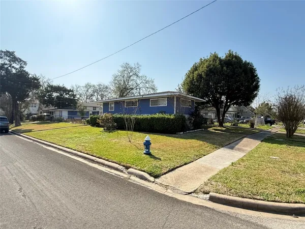a view of a playground with houses