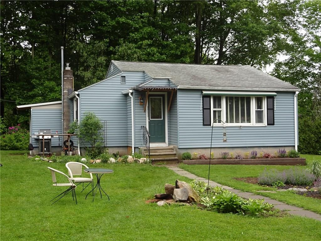 5 Power House Road Montville, CT 06382 - Photo 1 of 1 a backyard of a house with table and chairs
