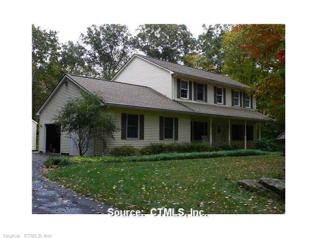 48 Harris Rd Extension Salem, CT 06420 - Photo 1 of 1 a front view of a house with a garden