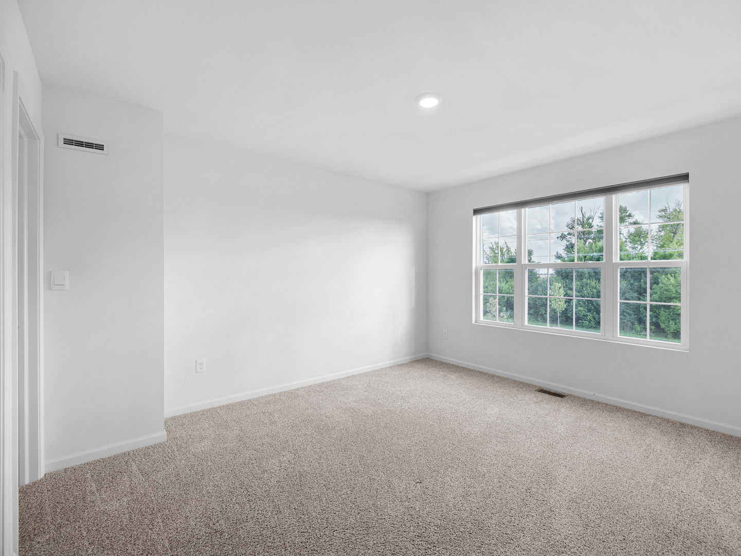 1533 Yosemite Way Pingree Grove, IL 60140 - Photo 12 of 17 a view of an empty room with a window