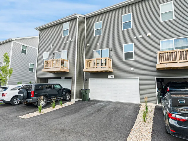 a view of a car park in front of house