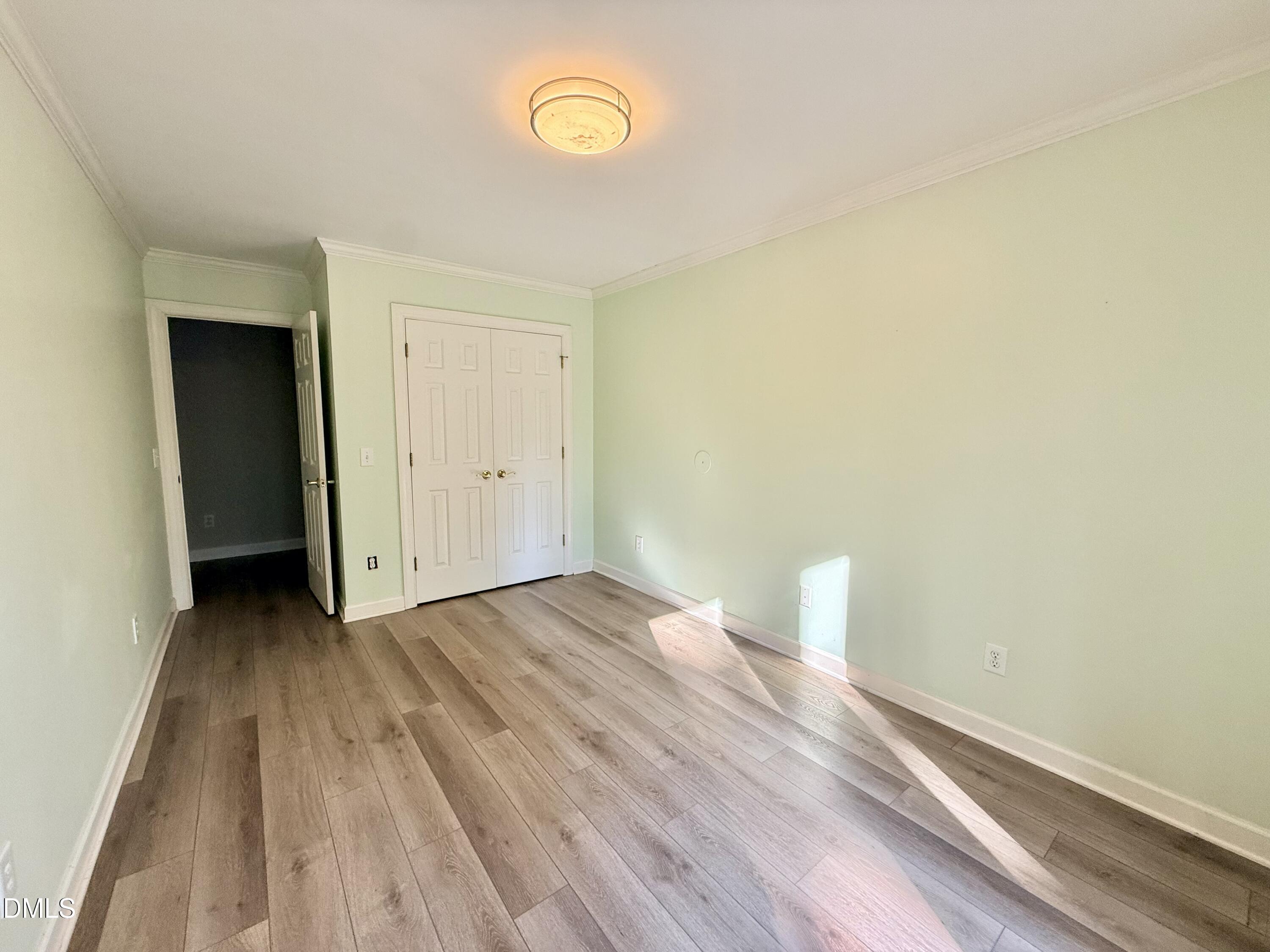 81 Beaver Crossing Road Roxboro, NC 27574 - Photo 39 of 80 an empty room with wooden floor and windows