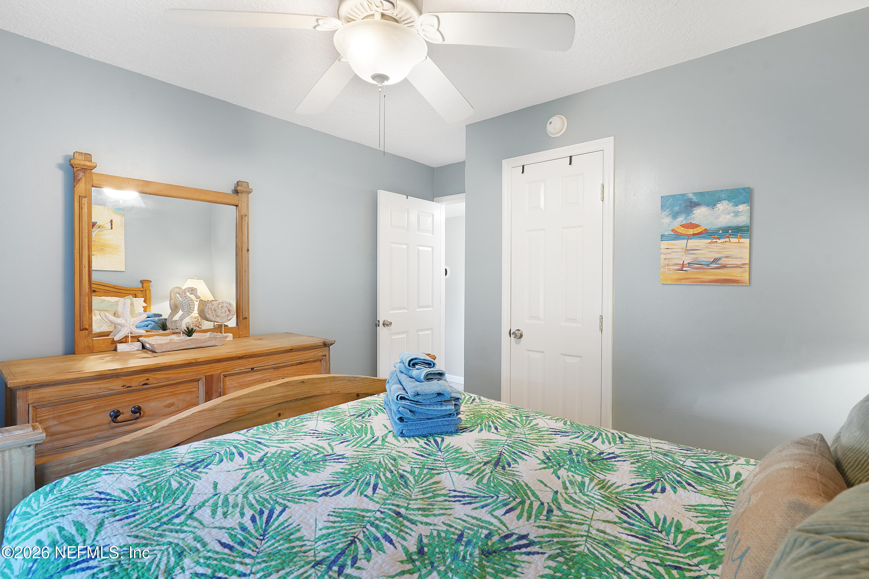 9 Clipper Court St. Augustine, FL 32080 - Photo 17 of 22 a bedroom with a bed and a mirror on dresser