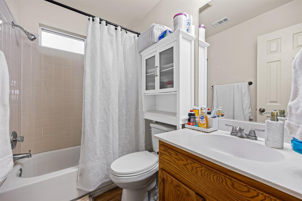 2304 Wilma Rudolph Road Austin, TX 78748 - Photo 14 of 18 Bathroom with shower / tub combo and vanity