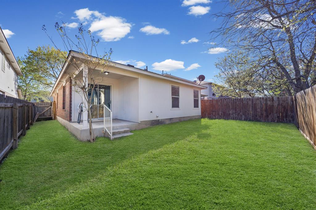 2304 Wilma Rudolph Road Austin, TX 78748 - Photo 16 of 18 Back of property with a patio area and a fenced backyard