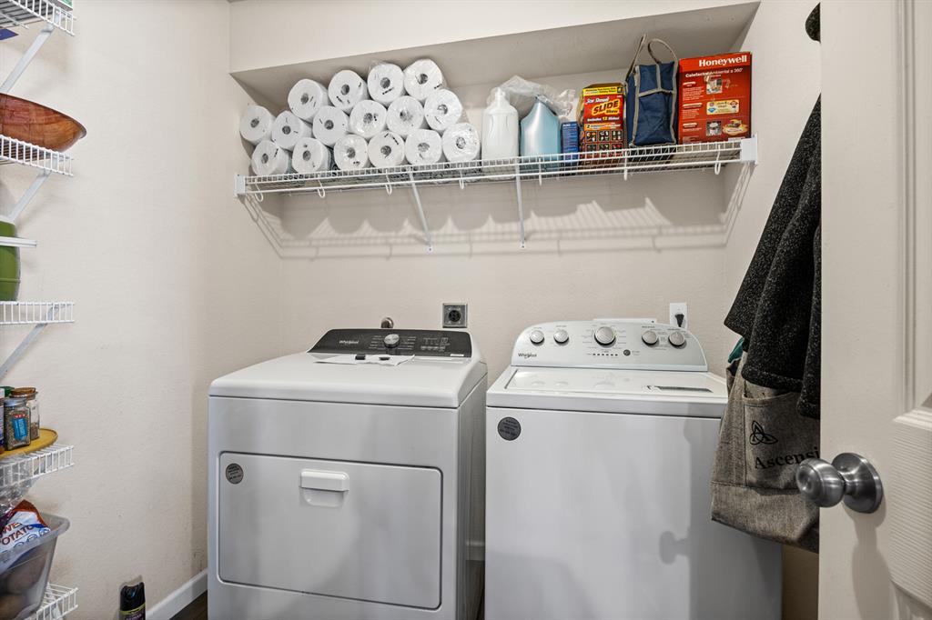 2304 Wilma Rudolph Road Austin, TX 78748 - Photo 18 of 18 Laundry room with washing machine and dryer and baseboards