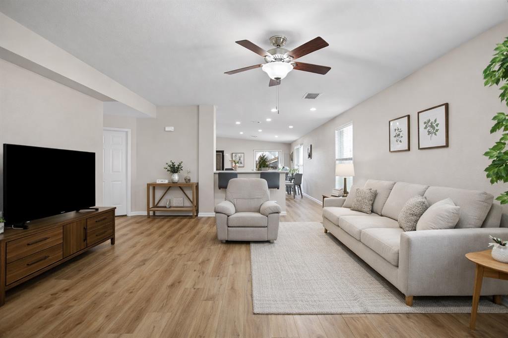 2304 Wilma Rudolph Road Austin, TX 78748 - Photo 3 of 18 Living area featuring light wood-style floors and a ceiling fan
