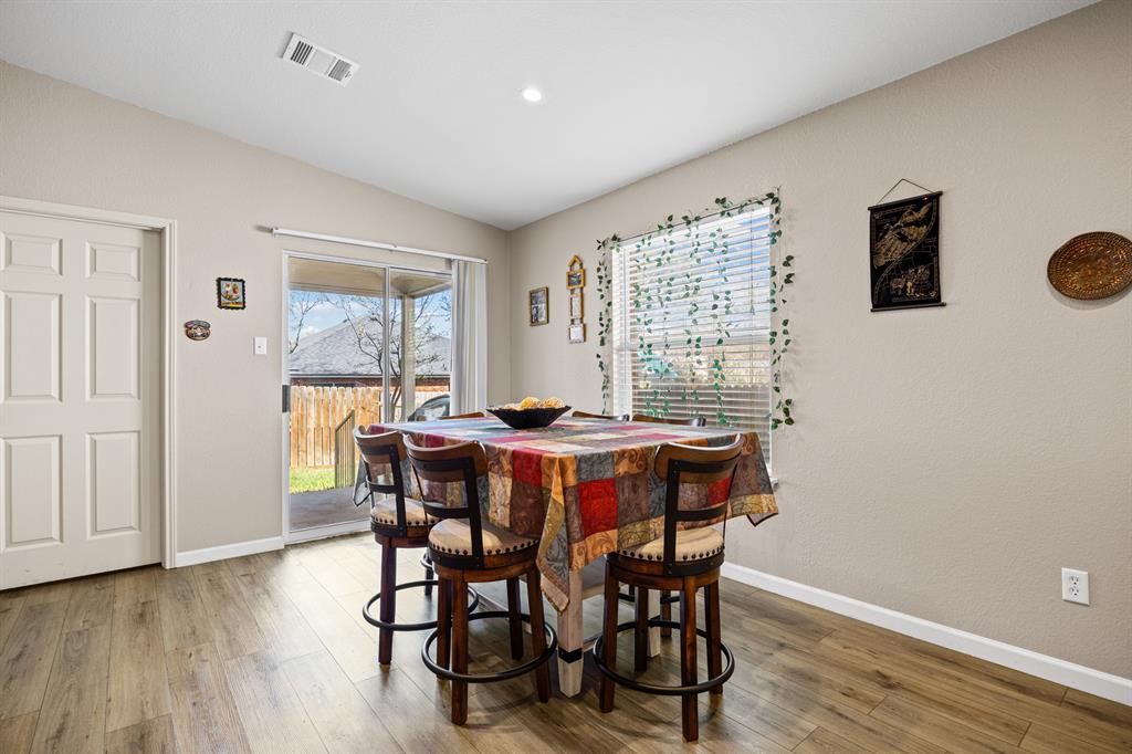 2304 Wilma Rudolph Road Austin, TX 78748 - Photo 8 of 18 Dining room with light wood-style floors and lofted ceiling