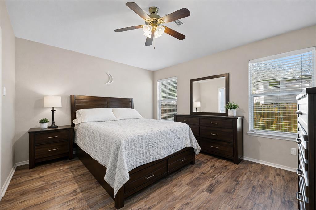 2304 Wilma Rudolph Road Austin, TX 78748 - Photo 9 of 18 Bedroom with dark wood-style flooring and ceiling fan