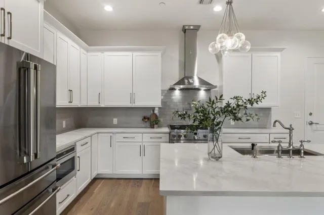 a table with a vase and flowers on it