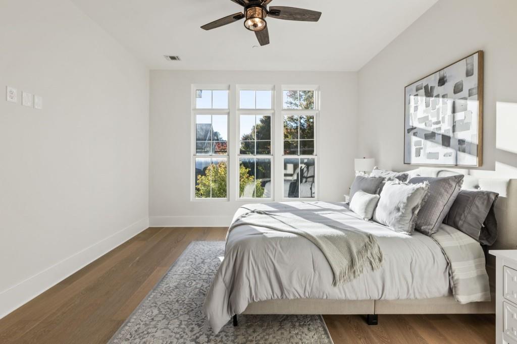 12455 Broadwell Road, Unit 202 Milton, GA 30004 - Photo 22 of 31 a bedroom with a bed and window