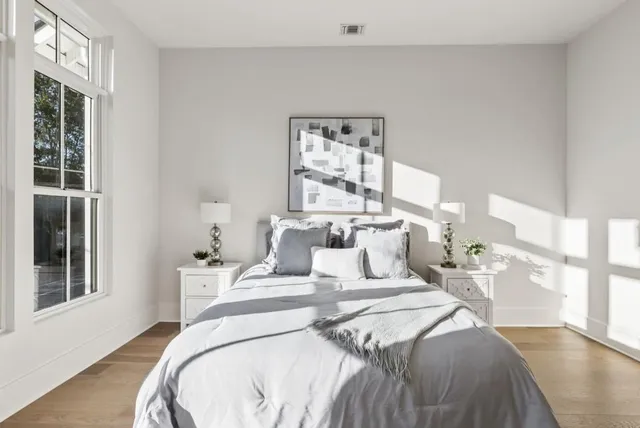 a bathroom with a double vanity sink mirror and shower