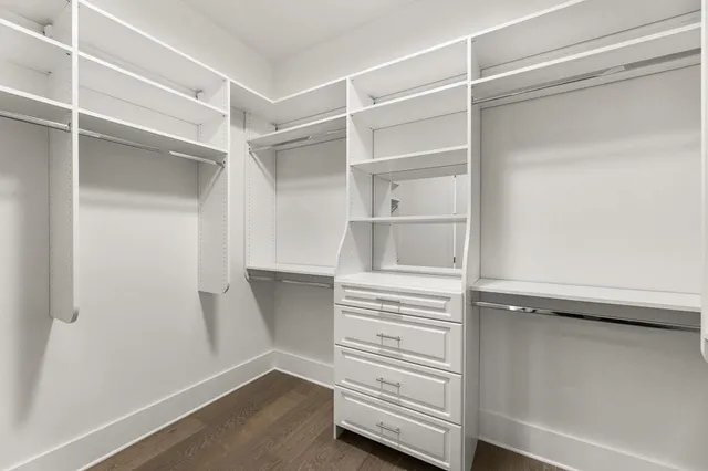 a bathroom with double vanity sinks and a mirror