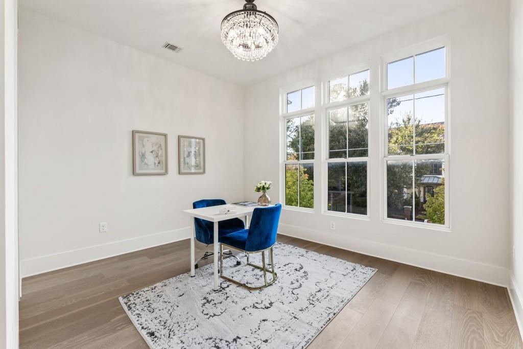 12455 Broadwell Road, Unit 202 Milton, GA 30004 - Photo 29 of 31 a view of a dining room with furniture window and wooden floor