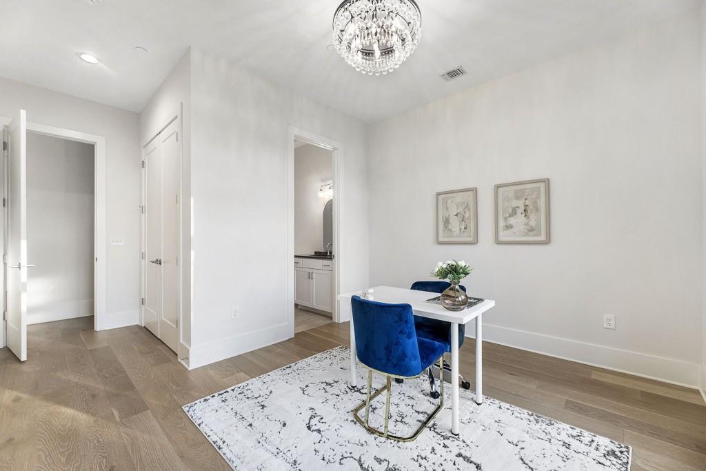 12455 Broadwell Road, Unit 202 Milton, GA 30004 - Photo 30 of 31 a workspace with furniture and wooden floor