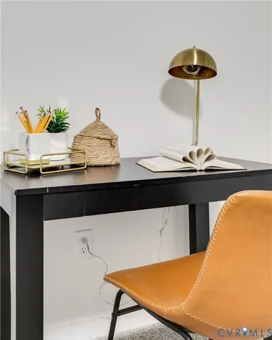 a bathroom with a sink a mirror and a potted plant