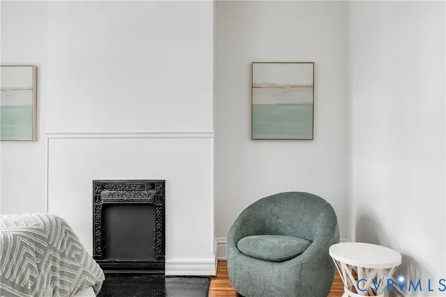 a bedroom with a bed and a fireplace