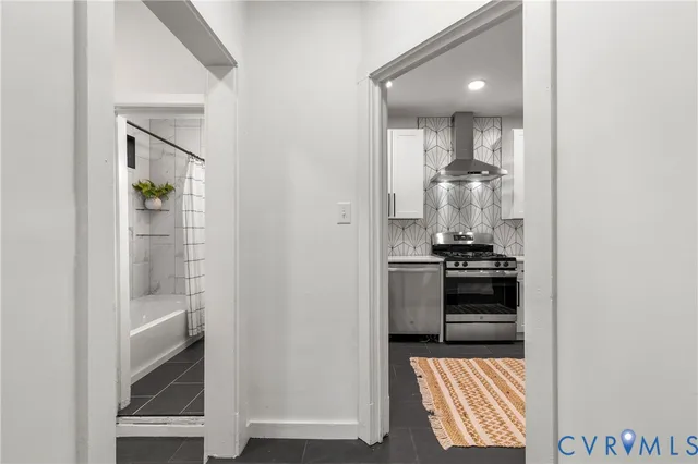 a bathroom with a shower and a sink