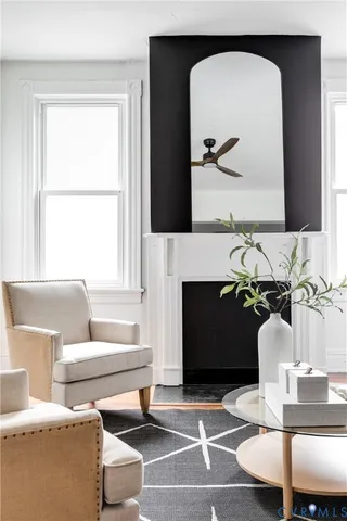 a living room with furniture and a fireplace