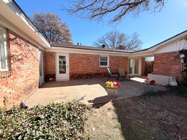 a view of a backyard with a patio