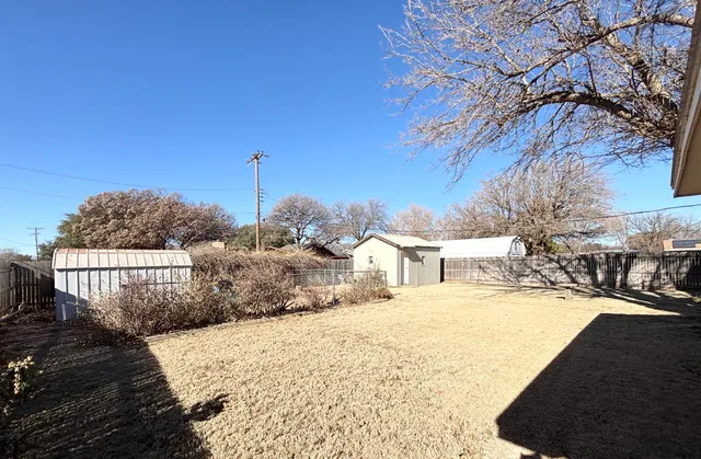 a view of a house with a snow on the road
