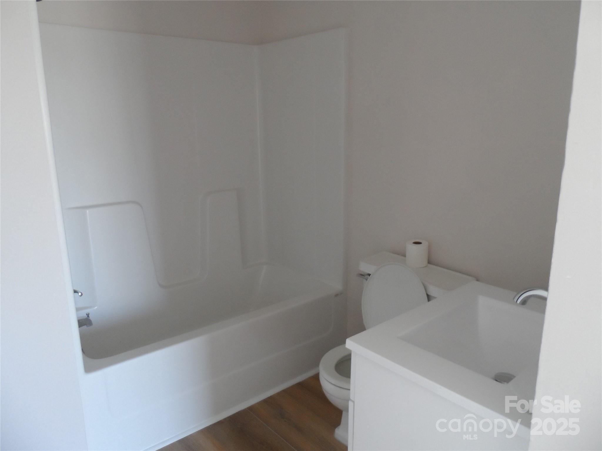 205 Phillips Street Morganton, NC 28655 - Photo 13 of 22 a bathroom with a sink and bathtub