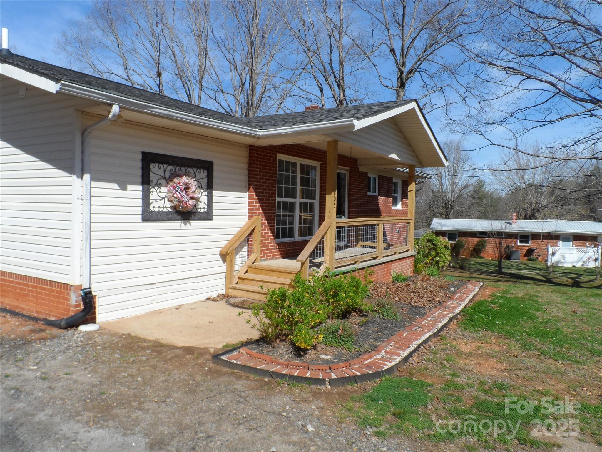 205 Phillips Street Morganton, NC 28655 - Photo 17 of 22 a front view of a house with a yard