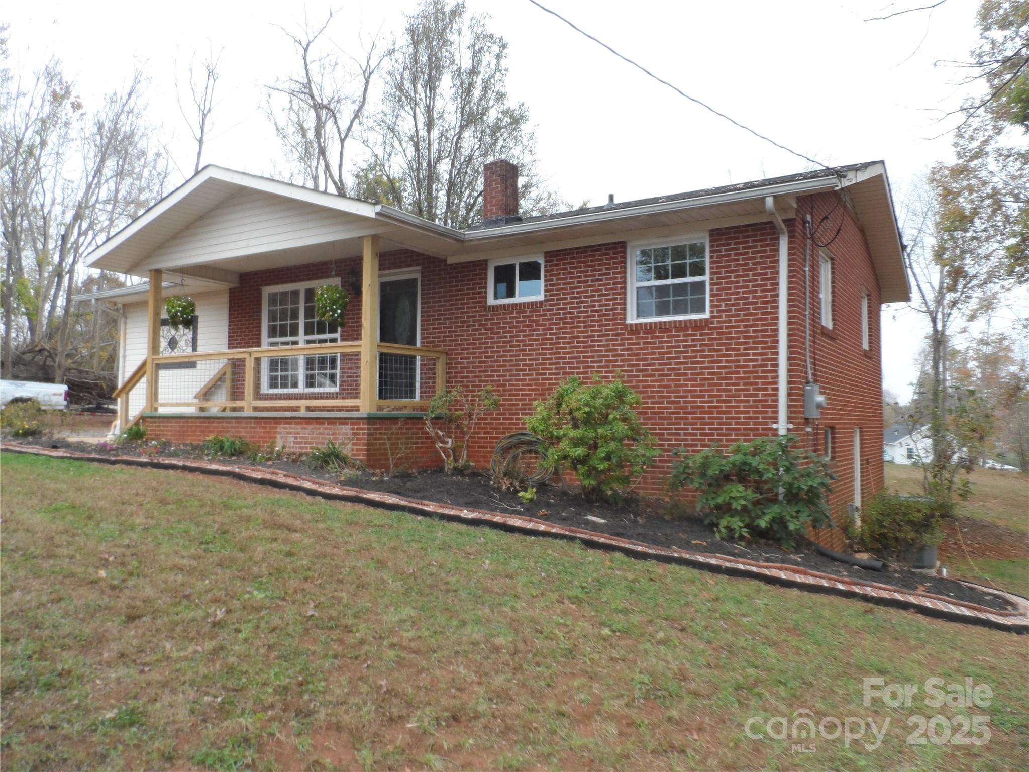 205 Phillips Street Morganton, NC 28655 - Photo 3 of 22 a front view of a house with garden