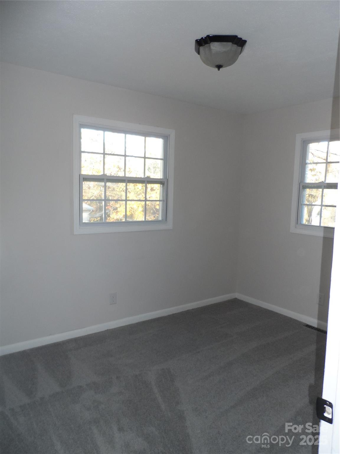 205 Phillips Street Morganton, NC 28655 - Photo 8 of 22 an empty room with a window