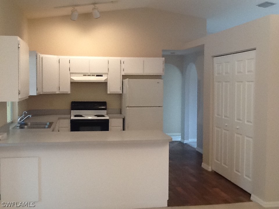17217 Oriole Road Fort Myers, FL 33967 - Photo 3 of 22 a kitchen with stainless steel appliances a refrigerator and a stove