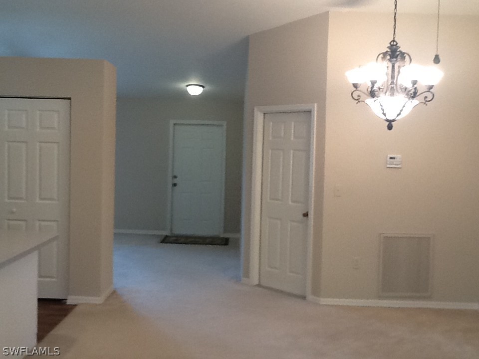 17217 Oriole Road Fort Myers, FL 33967 - Photo 4 of 22 a view of a chandelier in a room
