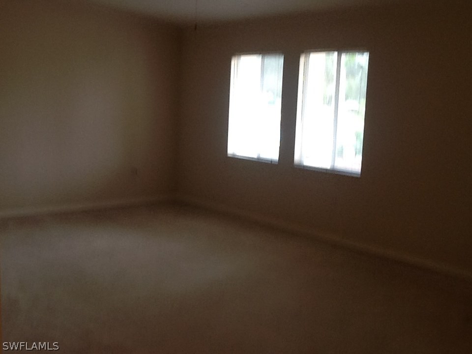 17217 Oriole Road Fort Myers, FL 33967 - Photo 5 of 22 an empty room with windows