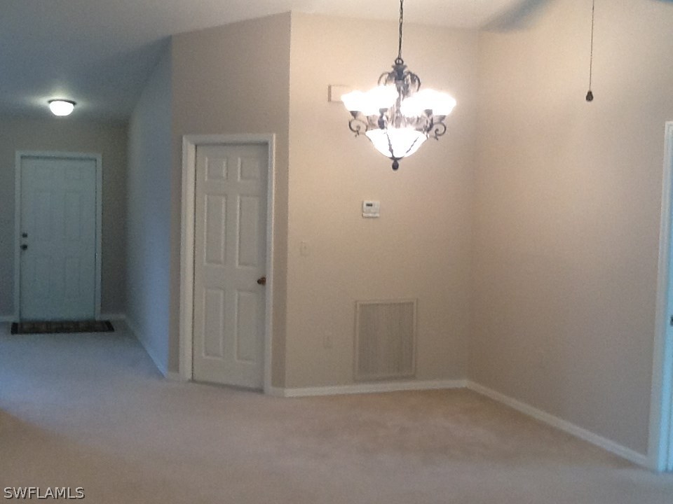 17217 Oriole Road Fort Myers, FL 33967 - Photo 6 of 22 a view of a chandelier in big room