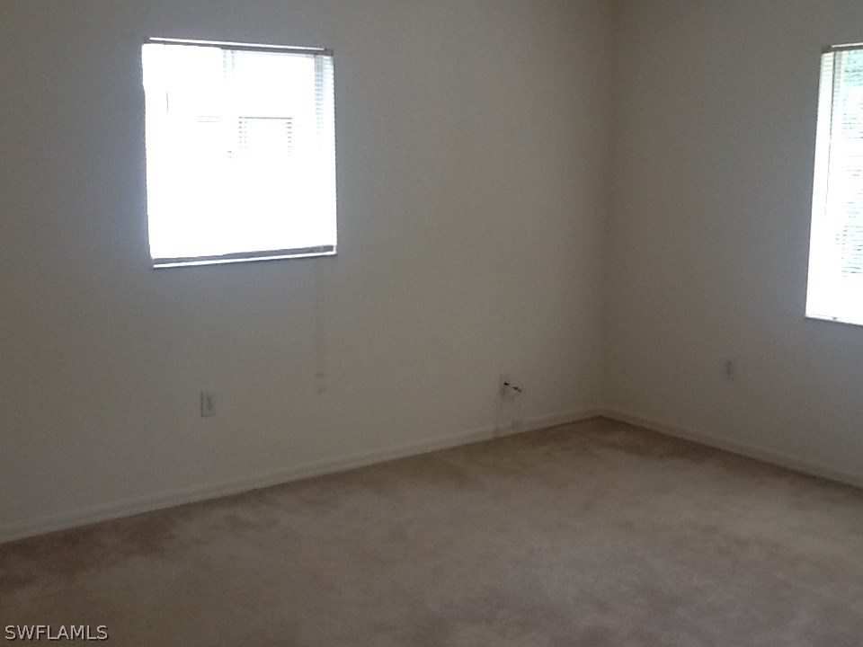 17217 Oriole Road Fort Myers, FL 33967 - Photo 7 of 22 an empty room with a window