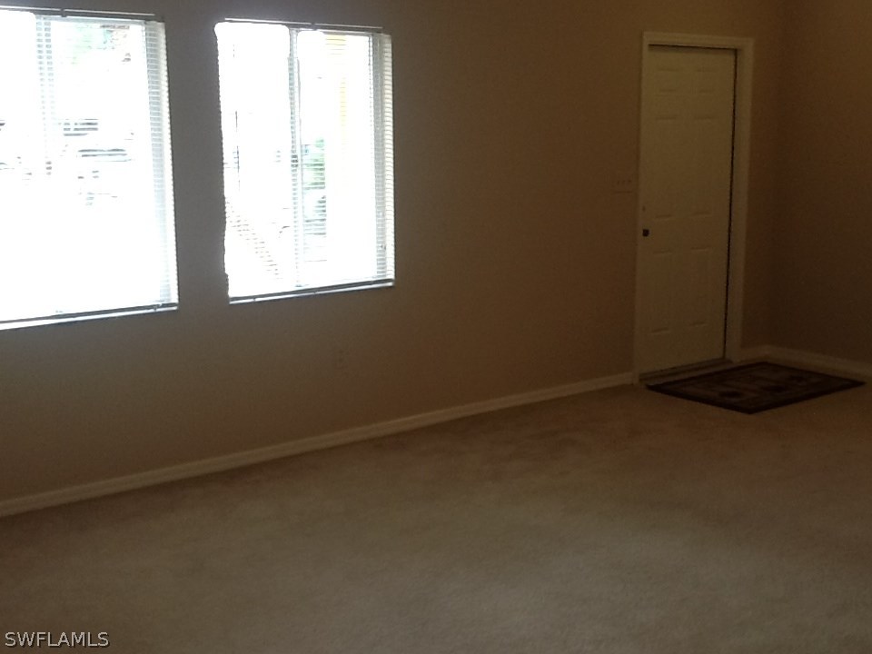 17217 Oriole Road Fort Myers, FL 33967 - Photo 10 of 22 an empty room with a window
