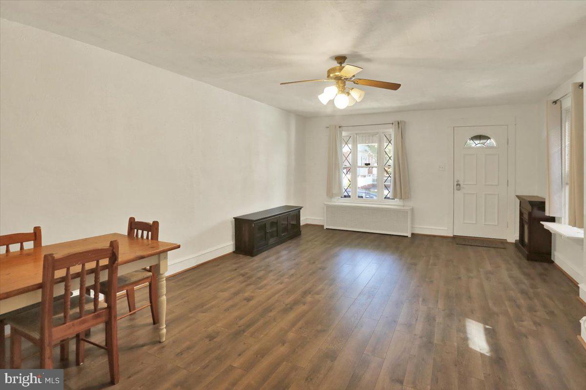 29 Arlington Street Reading, PA 19611 - Photo 8 of 32 a view of an empty room with window and wooden floor