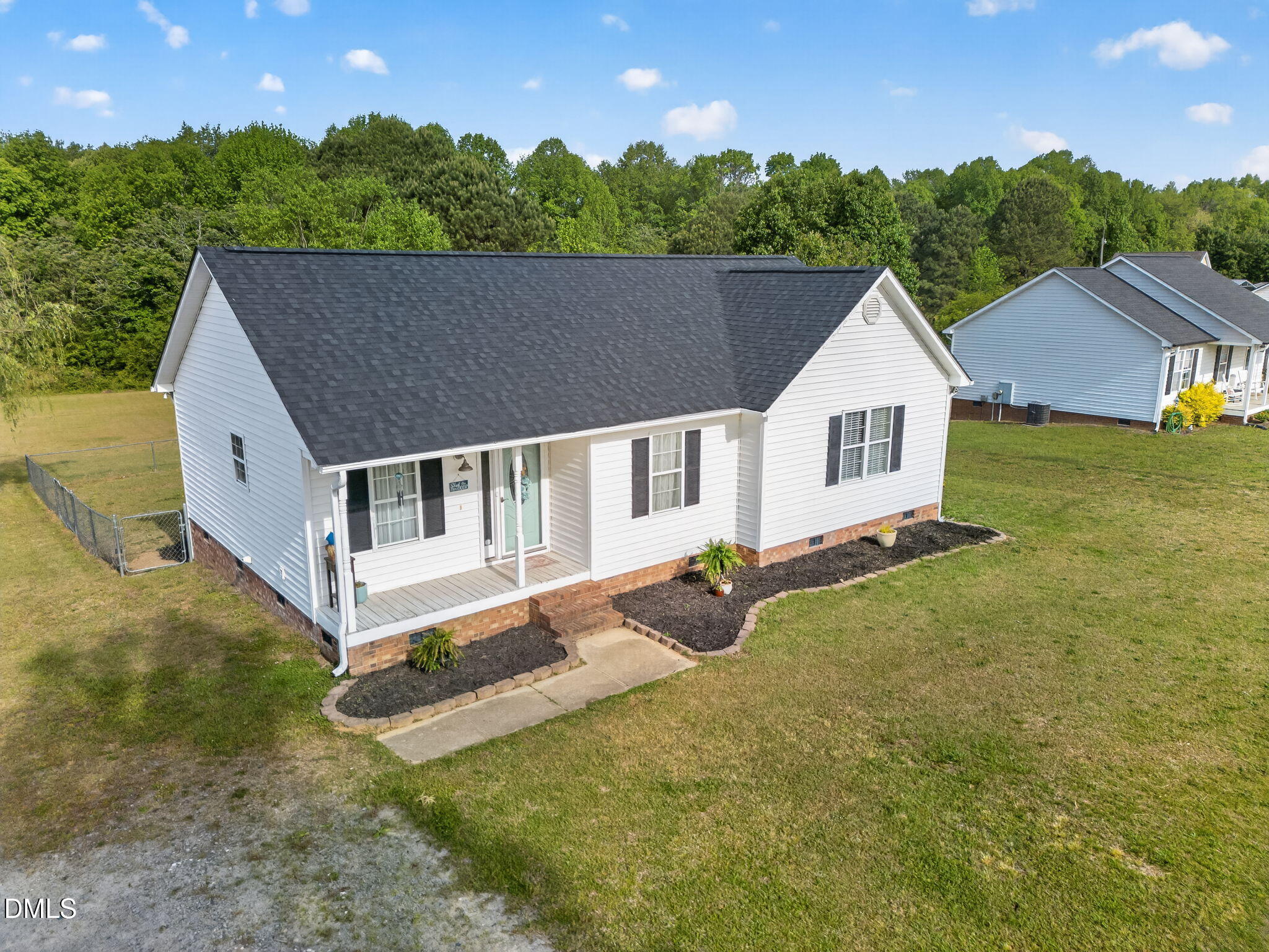 1101 Live Oak Road Coats, NC 27521 - Photo 27 of 29 a view of a house with backyard and sitting area