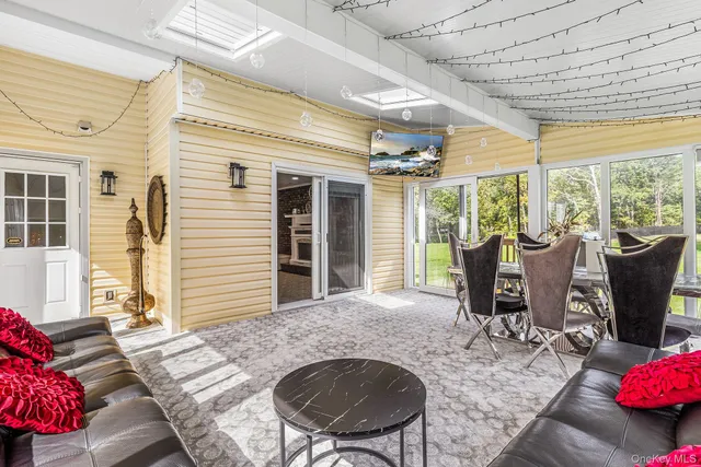 a view of a dining room with furniture window and outside view