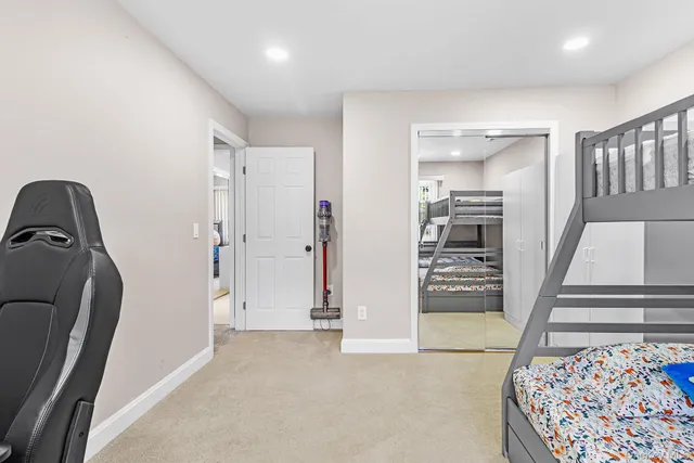 a view of a hallway with furniture and entryway