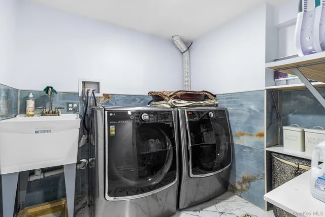 a utility room with dryer and washer
