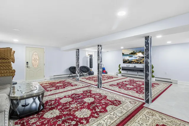 a bed room with furniture and a rug