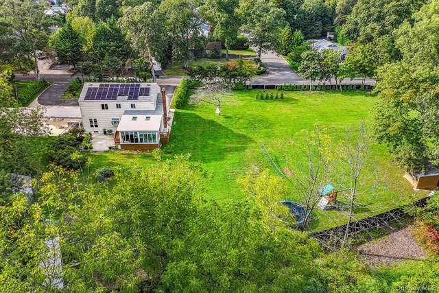 a backyard of a house with lots of green space